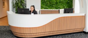 A lady sitting in the reception area of dentist on the Gold Coast clinic