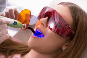 A woman having dental fillings placed by a dentist.