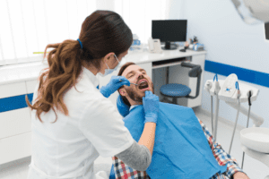 A dental doctor treating a patient's teeth